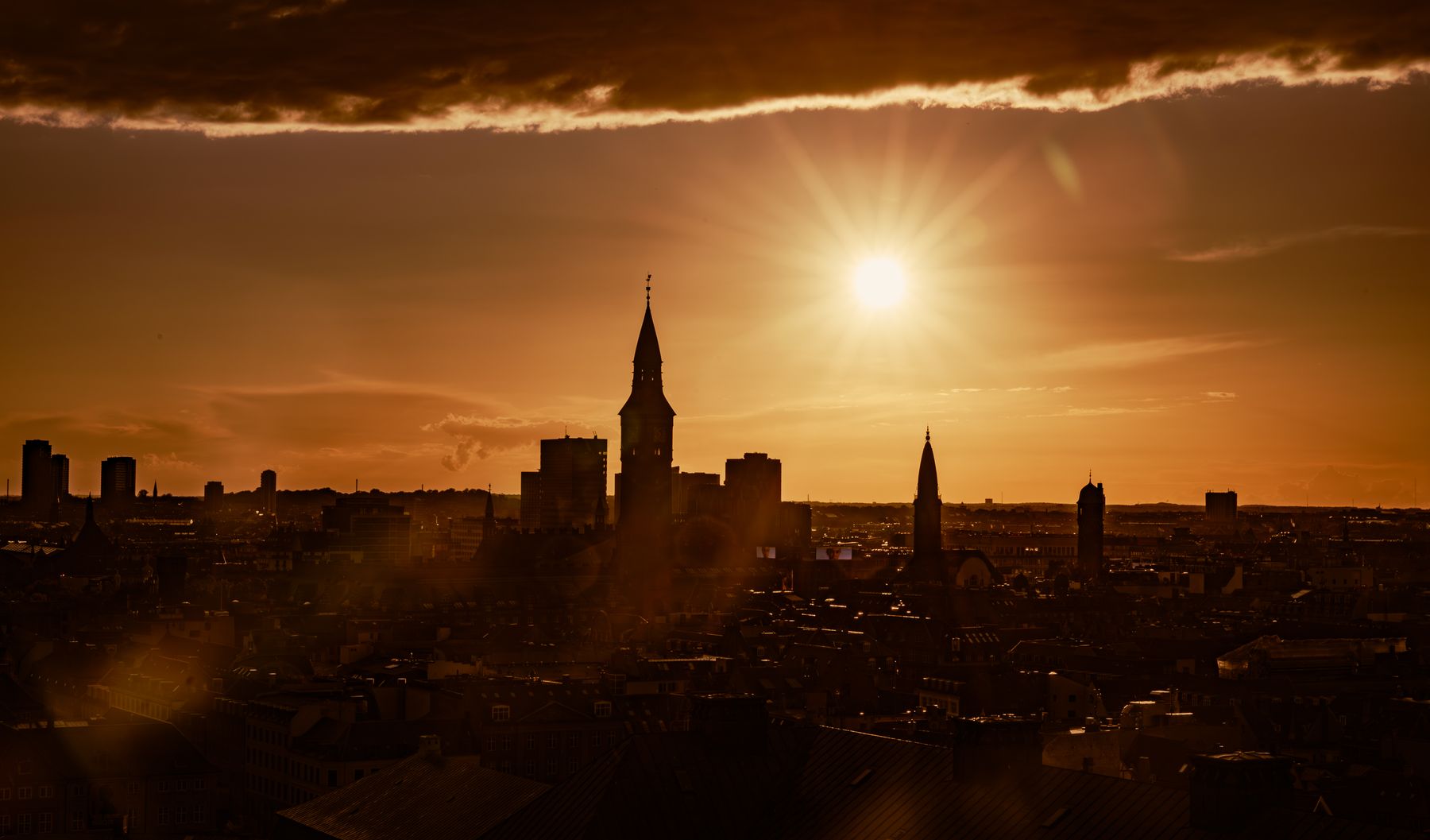 Sunburst Over Cityscape